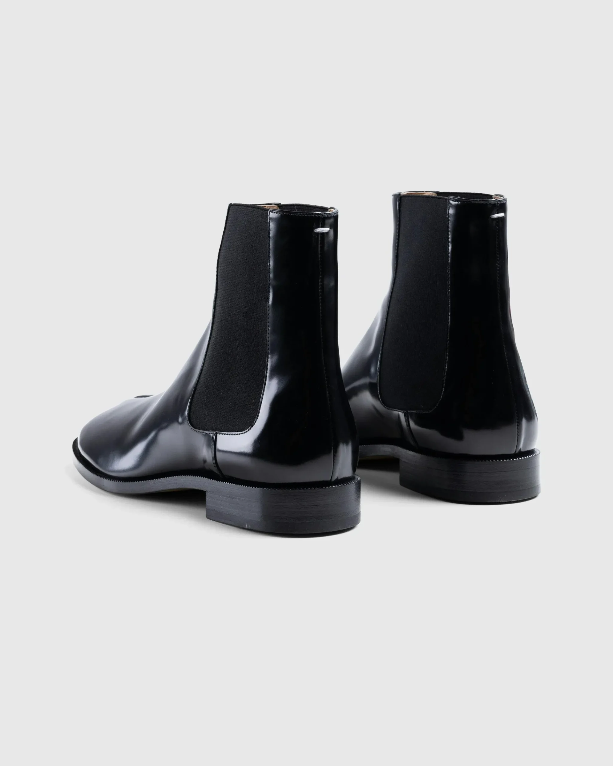 Shop Maison Margiela Leather Tabi Ankle Boot black/washed