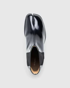 Shop Maison Margiela Leather Tabi Ankle Boot black/washed